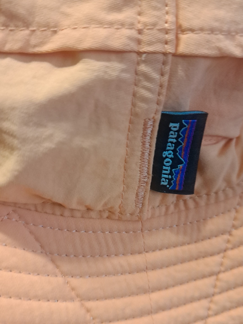 Patagonia Peach Bucket Hat with Black Logo Tag